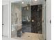 Luxurious shower features marble tiling, glass door, rain shower head, and a built-in bench at 1433 Wessyngton Ne Rd, Atlanta, GA 30306