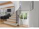 Modern staircase with wood treads and metal railings at 1433 Wessyngton Ne Rd, Atlanta, GA 30306