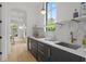 Stylish wet bar featuring dark wood cabinets, marble countertop, sink, and beverage cooler at 1433 Wessyngton Ne Rd, Atlanta, GA 30306