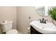 Bathroom features a vessel sink, dark wood vanity, and a decorative mirror at 1472 High Meadow Dr, Stone Mountain, GA 30083