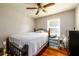 Bedroom featuring a bed, wood floors, and a window with natural light at 1472 High Meadow Dr, Stone Mountain, GA 30083
