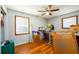 Bedroom with wood floors and two windows with natural light at 1472 High Meadow Dr, Stone Mountain, GA 30083