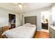 Bedroom with a bed, open closet, and bathroom in view at 1472 High Meadow Dr, Stone Mountain, GA 30083