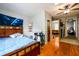 Spacious bedroom with hardwood floors, a bed, and a ceiling fan at 1472 High Meadow Dr, Stone Mountain, GA 30083