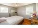 Bedroom featuring a bed, dresser, and natural light from two windows at 1472 High Meadow Dr, Stone Mountain, GA 30083