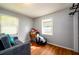 Bedroom with hardwood floors, natural light from two windows, and ample space at 1472 High Meadow Dr, Stone Mountain, GA 30083