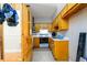 Galley kitchen with yellow cabinets and white countertops at 1472 High Meadow Dr, Stone Mountain, GA 30083