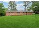 Expansive backyard with lush green grass, offering plenty of space for outdoor activities and relaxation at 1913 Ferry Dr, Marietta, GA 30066