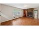 Cozy living room with a brick fireplace, built-in bookshelves, and bright natural light at 1913 Ferry Dr, Marietta, GA 30066