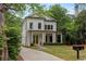 Charming two-story home with a well-manicured lawn and inviting front porch at 357 Mell Avenue, Atlanta, GA 30307