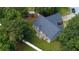 Aerial view of a well-maintained home with a covered patio and lush greenery at 556 Walton Dr, Social Circle, GA 30025