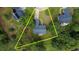 The aerial shot displays a well-manicured yard and mature trees surrounding the property at 556 Walton Dr, Social Circle, GA 30025