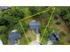 Enjoy the view! Aerial showcases home's landscaping and location in the neighborhood at 556 Walton Dr, Social Circle, GA 30025