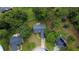 Aerial view showcases the home's location amidst a tree-filled neighborhood at 556 Walton Dr, Social Circle, GA 30025