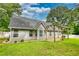 The spacious backyard features a well-maintained lawn and patio, perfect for outdoor enjoyment at 556 Walton Dr, Social Circle, GA 30025