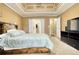 Bedroom showcasing a bed, television, and ensuite bath access at 556 Walton Dr, Social Circle, GA 30025