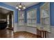 Charming breakfast nook with lots of windows and natural light adjacent to the kitchen at 556 Walton Dr, Social Circle, GA 30025