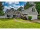 Charming single-Gathering home with a well-maintained lawn and attached two-car garage at 556 Walton Dr, Social Circle, GA 30025