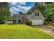 Charming single-Gathering home with a well-maintained lawn and attached two-car garage at 556 Walton Dr, Social Circle, GA 30025