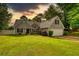 Charming single-Gathering home with a well-maintained lawn and attached two-car garage at 556 Walton Dr, Social Circle, GA 30025