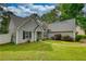 Charming single-Gathering home with a well-maintained lawn and attached two-car garage at 556 Walton Dr, Social Circle, GA 30025