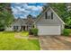 Charming single-Gathering home with a well-maintained lawn and attached two-car garage at 556 Walton Dr, Social Circle, GA 30025