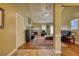 Inviting living room featuring a cozy fireplace, wood floors, and vaulted ceilings at 556 Walton Dr, Social Circle, GA 30025