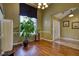 Inviting living room featuring wood floors, large windows, and modern lighting at 556 Walton Dr, Social Circle, GA 30025