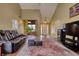 Bright living room with vaulted ceilings, wood floors, and lots of natural light at 556 Walton Dr, Social Circle, GA 30025