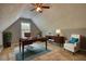 Charming office space with sloped ceilings, plush carpet, and a ceiling fan at 556 Walton Dr, Social Circle, GA 30025