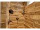Modern shower featuring wood-look tile and bronze fixtures at 556 Walton Dr, Social Circle, GA 30025
