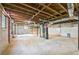 Unfinished basement with concrete floors, exposed beams, and utility hookups visible at 1703 Barrett Nw Dr, Atlanta, GA 30318