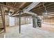 Unfinished basement featuring exposed beams, concrete floors, and a new water heater at 1703 Barrett Nw Dr, Atlanta, GA 30318