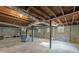 Unfinished basement with exposed beams, concrete floors, and utilities, ready for your personal touch at 1703 Barrett Nw Dr, Atlanta, GA 30318