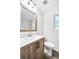 Bathroom with white marble countertop and light oak vanity and fixtures at 1703 Barrett Nw Dr, Atlanta, GA 30318