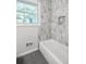Bathroom features a tiled shower/tub combo with a niche at 1703 Barrett Nw Dr, Atlanta, GA 30318