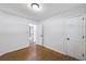 Clean bedroom featuring hardwood floors, base trim, and fresh neutral paint at 1703 Barrett Nw Dr, Atlanta, GA 30318