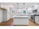 Modern kitchen featuring white cabinetry, stainless steel appliances, and granite countertops at 1703 Barrett Nw Dr, Atlanta, GA 30318
