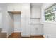 Bright kitchen features shaker cabinets, stainless steel hardware, and granite countertops at 1703 Barrett Nw Dr, Atlanta, GA 30318