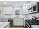 Bright, updated kitchen featuring stainless steel appliances and granite counters at 1703 Barrett Nw Dr, Atlanta, GA 30318