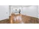 Spacious living area with hardwood floors, leading into a modern kitchen at 1703 Barrett Nw Dr, Atlanta, GA 30318