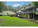 Charming backyard with a well-maintained lawn, spacious wooden deck and beautiful screened in porch at 2110 Waterloo Cir, Lawrenceville, GA 30043