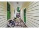 Charming walkway through backyard featuring green doors, rock accents, and outdoor access at 2110 Waterloo Cir, Lawrenceville, GA 30043