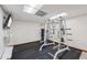 Basement with rubber flooring, workout equipment, and a wall-mounted television at 2110 Waterloo Cir, Lawrenceville, GA 30043