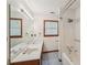 Bathroom featuring a double vanity and a tub with shower at 2110 Waterloo Cir, Lawrenceville, GA 30043