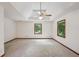 The main bedroom features plush carpet, neutral paint, and a tray ceiling with fan at 2110 Waterloo Cir, Lawrenceville, GA 30043