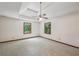 The large main bedroom includes plush carpet, two windows, and a ceiling fan at 2110 Waterloo Cir, Lawrenceville, GA 30043