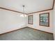 A formal dining room with tile flooring and wood trim around the ceiling at 2110 Waterloo Cir, Lawrenceville, GA 30043