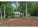 A charming two-story home surrounded by mature trees and lush landscaping at 2110 Waterloo Cir, Lawrenceville, GA 30043