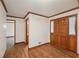 View of front entry shows hardwood floors, wood door, and white walls with trim at 2110 Waterloo Cir, Lawrenceville, GA 30043
